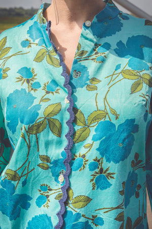 Veste turquoise à fleurs style 70s